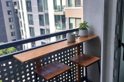 Small Balcony Bar Ideas With Stools and a Rail Shelf
